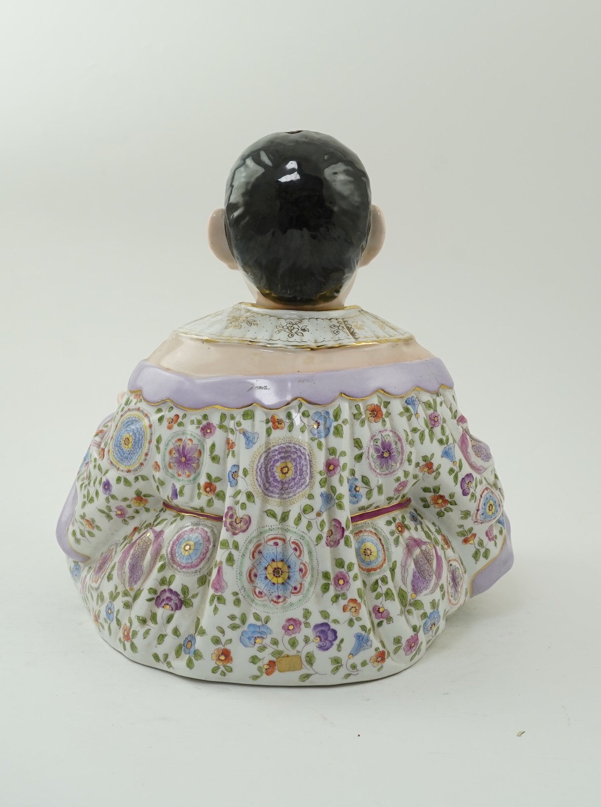 A large Continental porcelain figure of a seated nodding Buddha, early 20th century